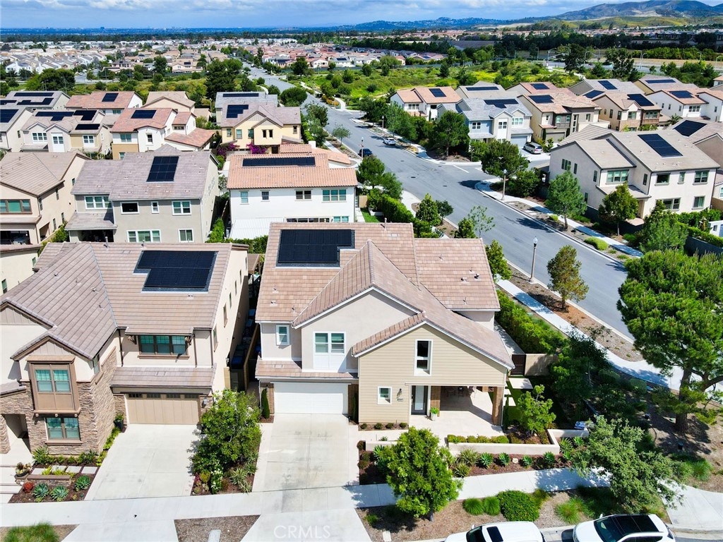 115 Crossover Irvine, CA 92618 - Photo 2 of 64 an aerial view of multiple houses with a yard
