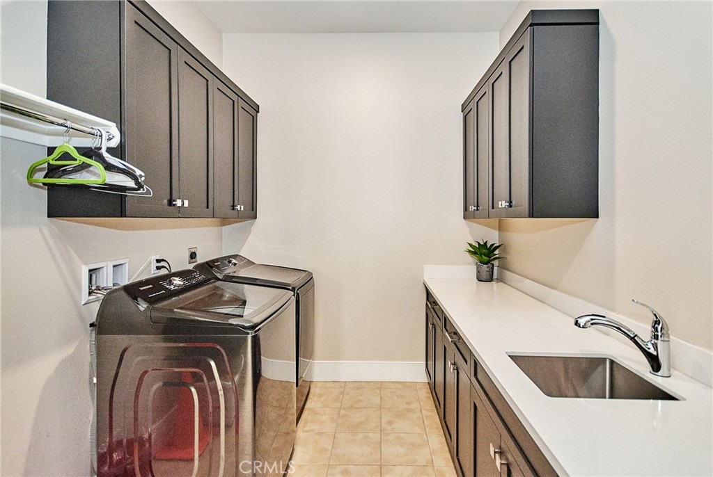 115 Crossover Irvine, CA 92618 - Photo 34 of 64 a view of a kitchen with sink dryer and washer