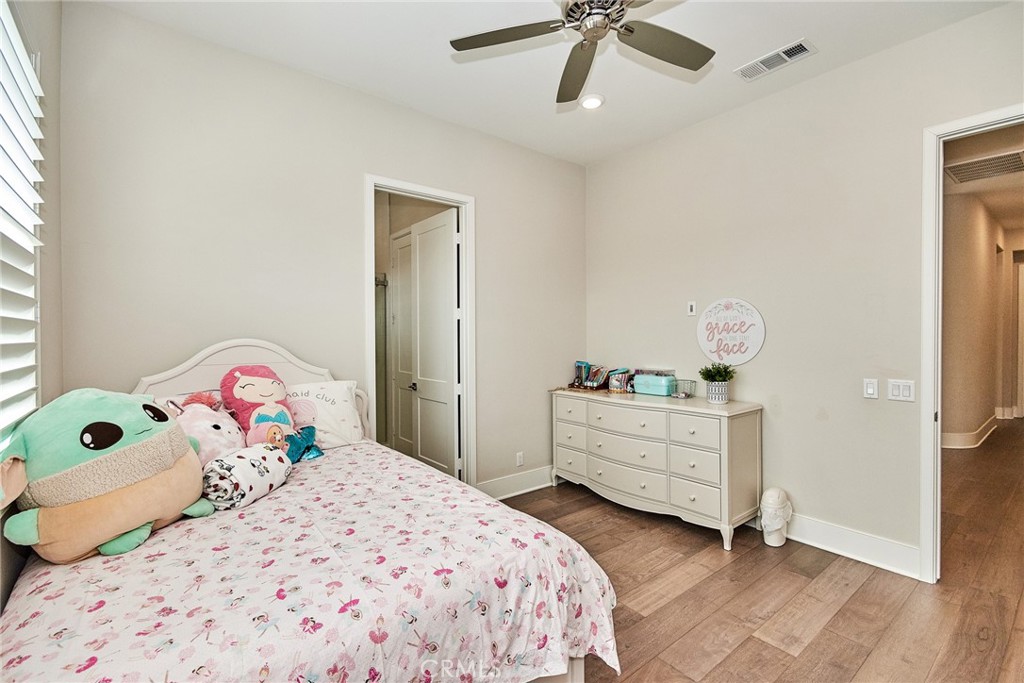 115 Crossover Irvine, CA 92618 - Photo 49 of 64 a bedroom with a bed and a dresser
