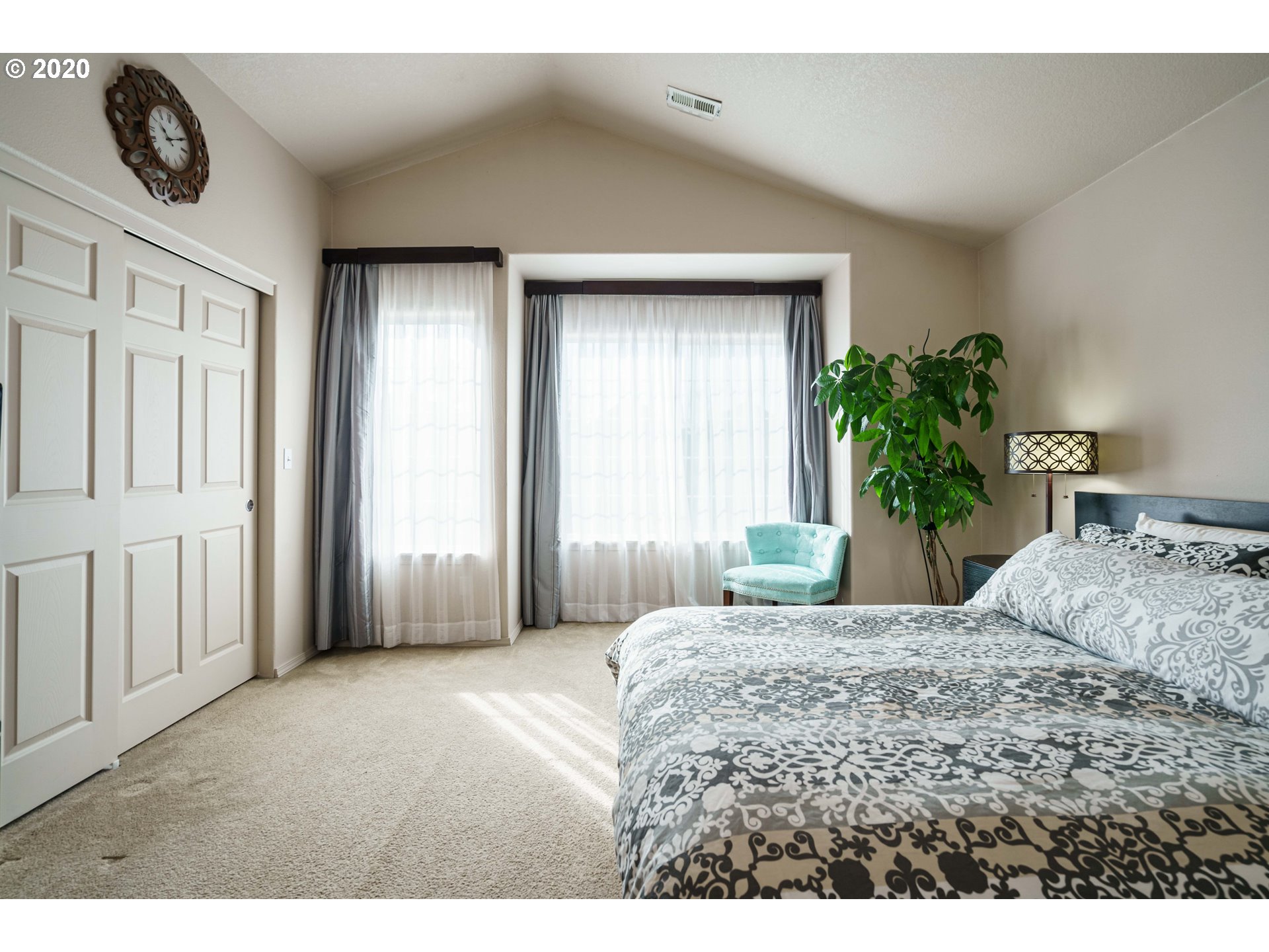 5843 Southeast 16th Loop Gresham, OR 97080 - Photo 16 of 30 a bedroom with a bed and a window