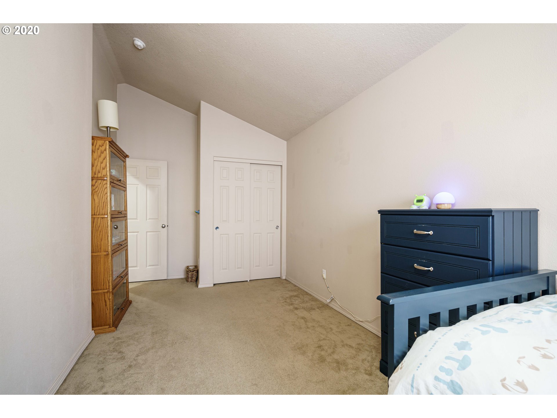 5843 Southeast 16th Loop Gresham, OR 97080 - Photo 24 of 30 a bedroom with a bed and a dresser