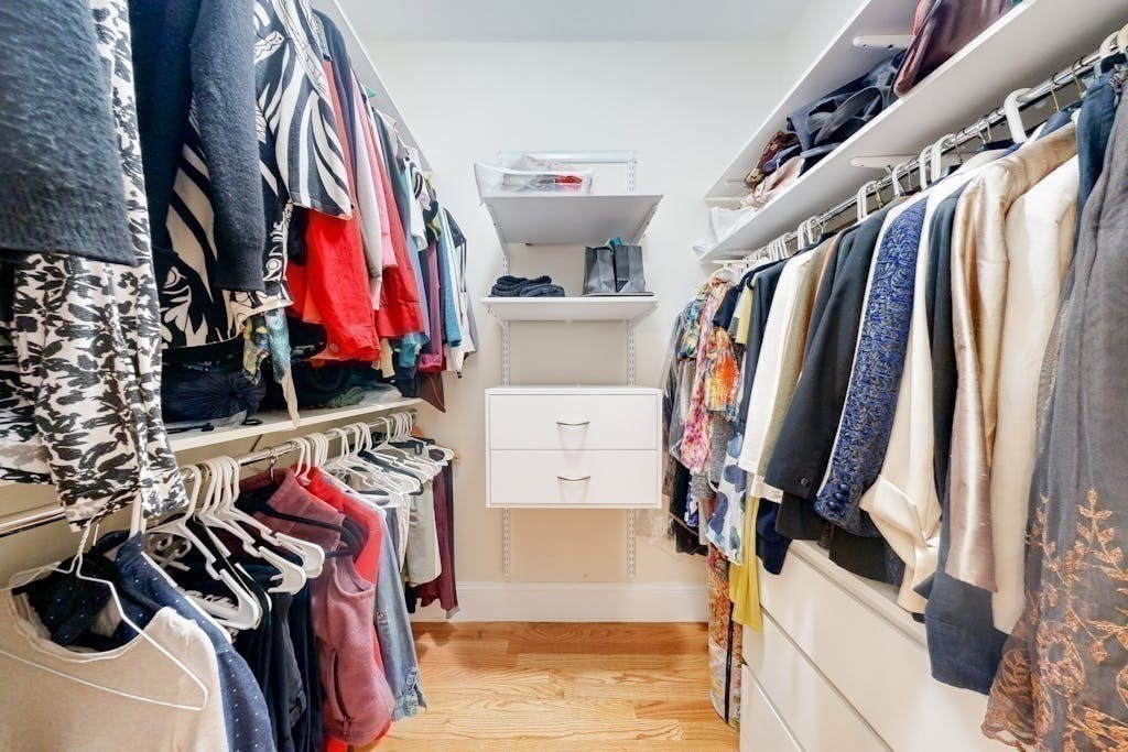 31 Sunset Ridge Lane, Unit 31 Bolton, MA 01740 - Photo 13 of 25 a view of walk in closet with clothes and shoes