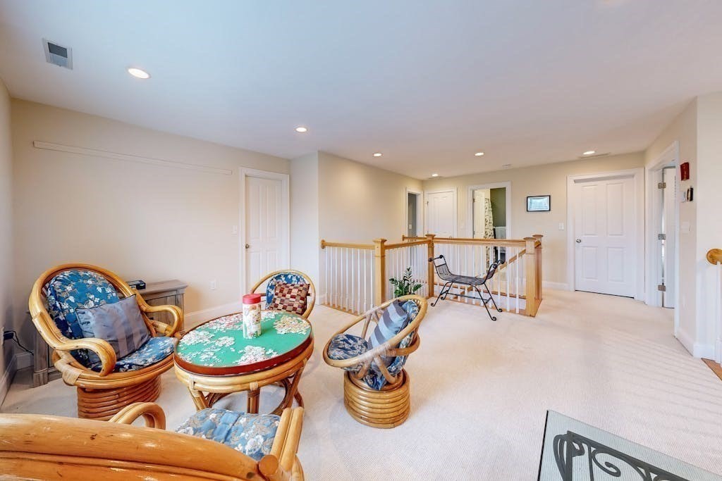 31 Sunset Ridge Lane, Unit 31 Bolton, MA 01740 - Photo 18 of 25 a living room with dining room and wooden floor