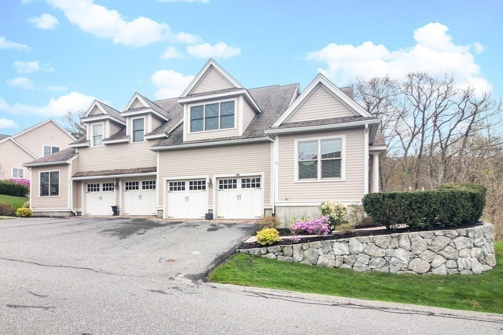 31 Sunset Ridge Lane, Unit 31 Bolton, MA 01740 - Photo 22 of 25 a front view of a house with garden