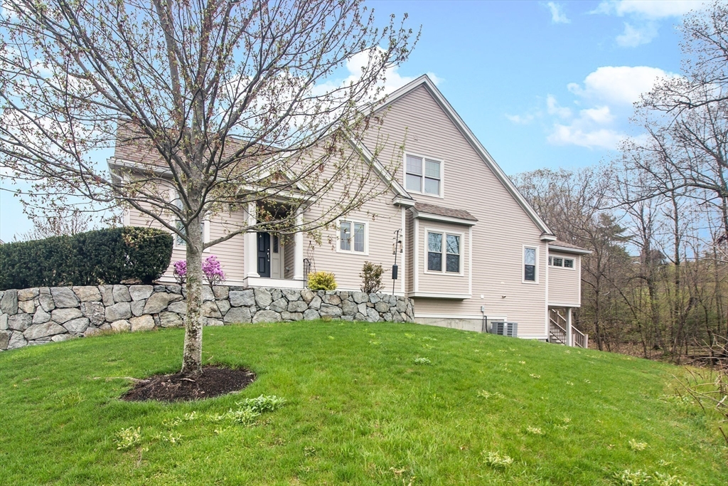 31 Sunset Ridge Lane, Unit 31 Bolton, MA 01740 - Photo 23 of 25 a front view of house with a garden