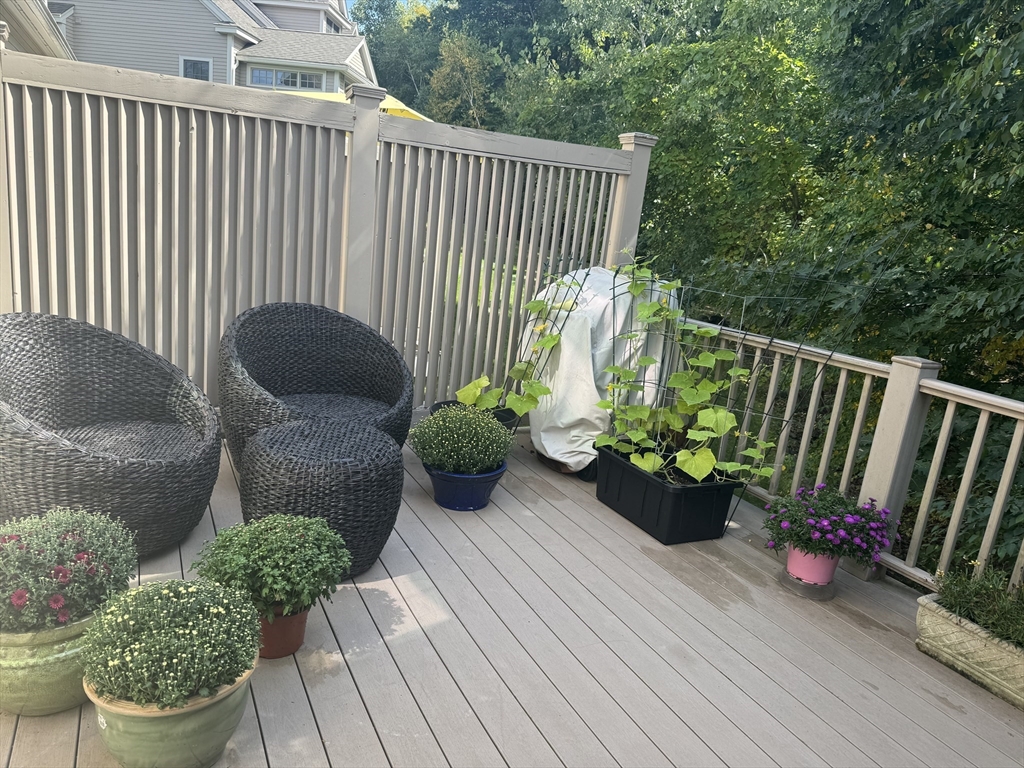 31 Sunset Ridge Lane, Unit 31 Bolton, MA 01740 - Photo 7 of 25 a view of a chair and table in the balcony