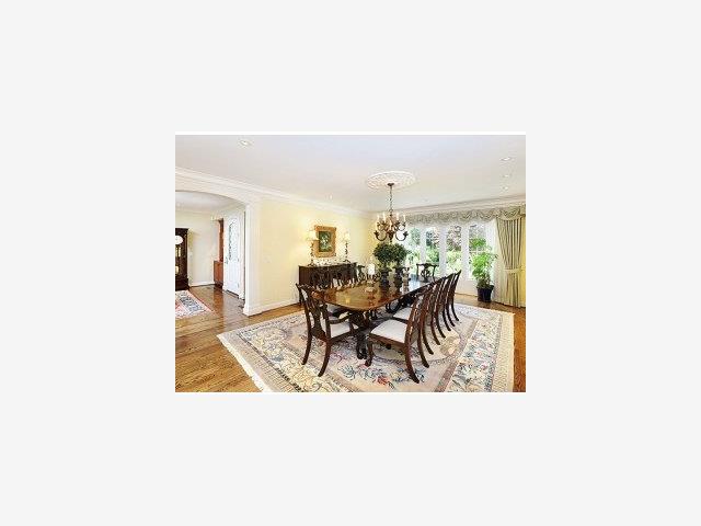 100 Bridge Road Hillsborough, CA 94010 - Photo 4 of 9 a view of a dining room with furniture and a chandelier