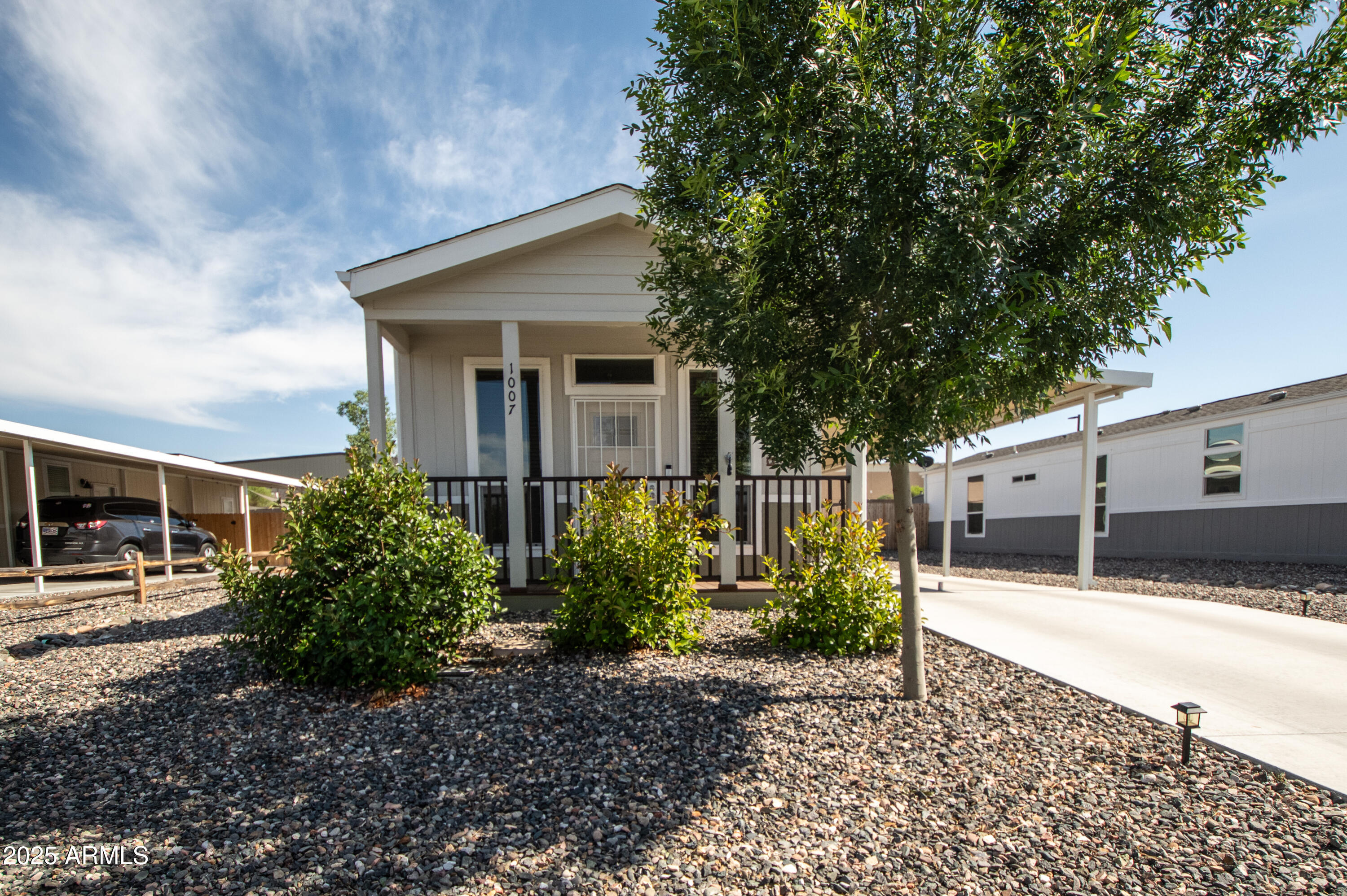 1007 Thorton Road Camp Verde, AZ 86322 - Photo 1 of 32 a house with trees in front of it