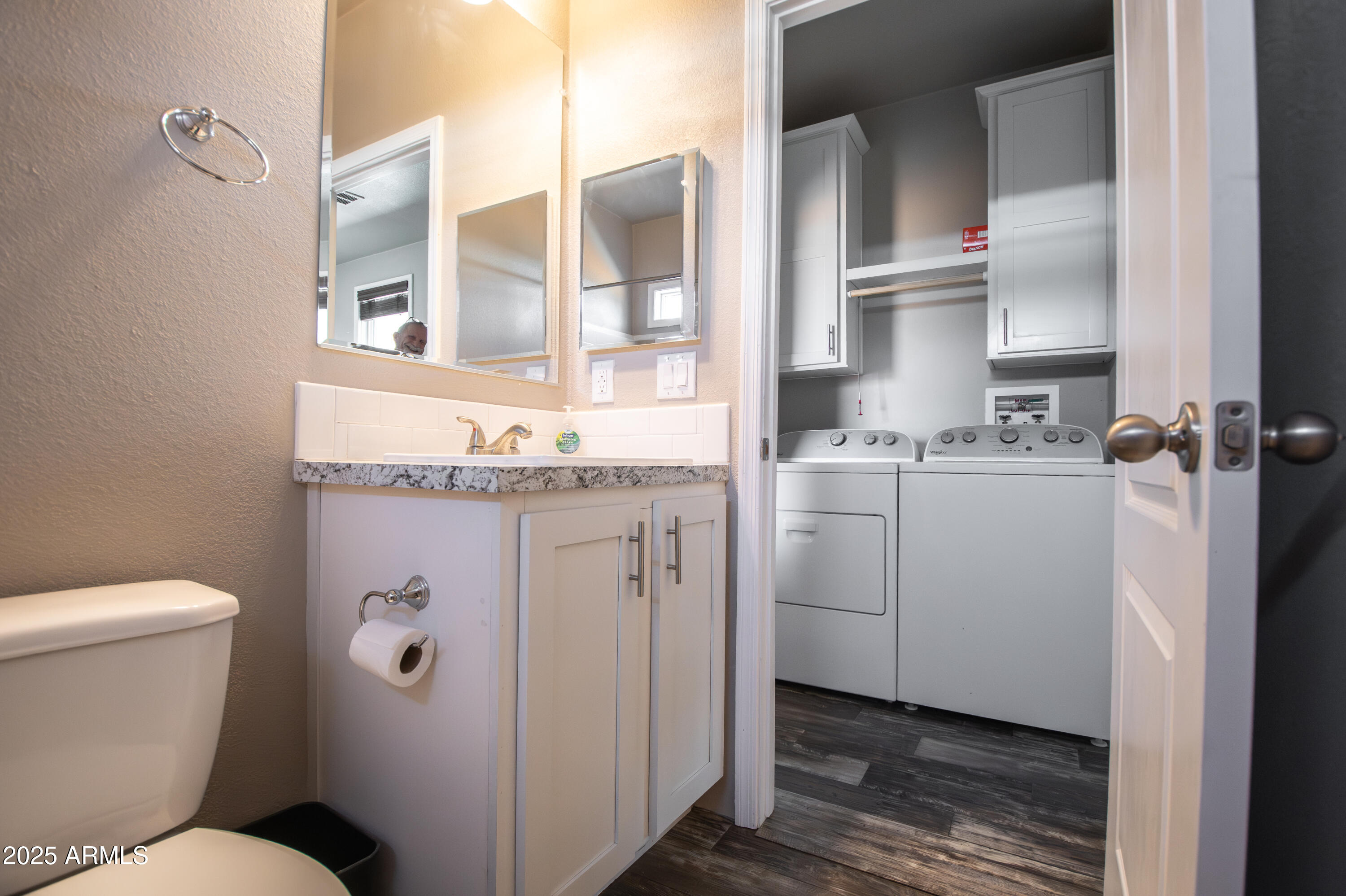 1007 Thorton Road Camp Verde, AZ 86322 - Photo 16 of 32 a bathroom with a granite countertop toilet sink and mirror