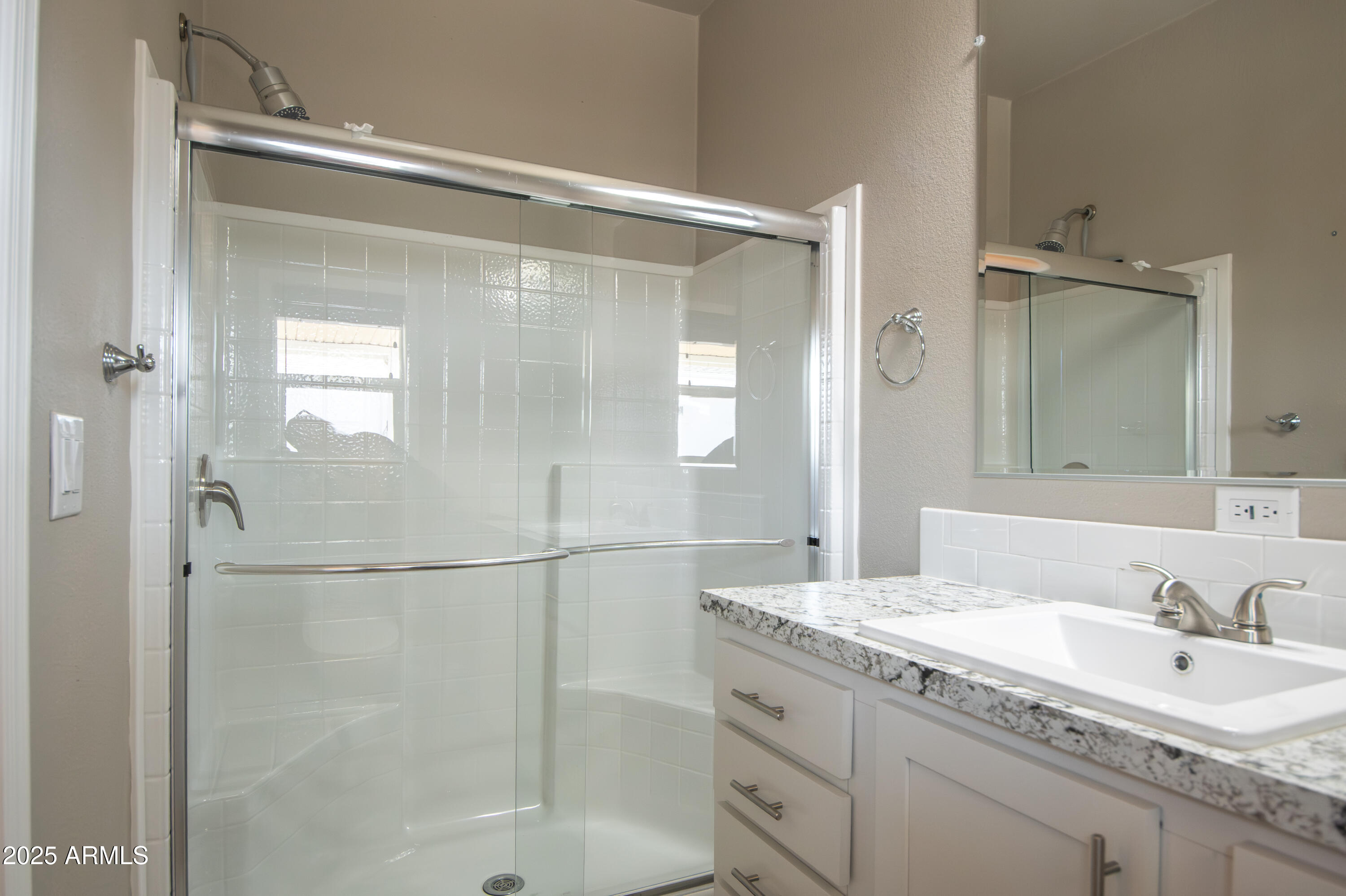 1007 Thorton Road Camp Verde, AZ 86322 - Photo 23 of 32 a bathroom with a granite countertop shower sink and mirror