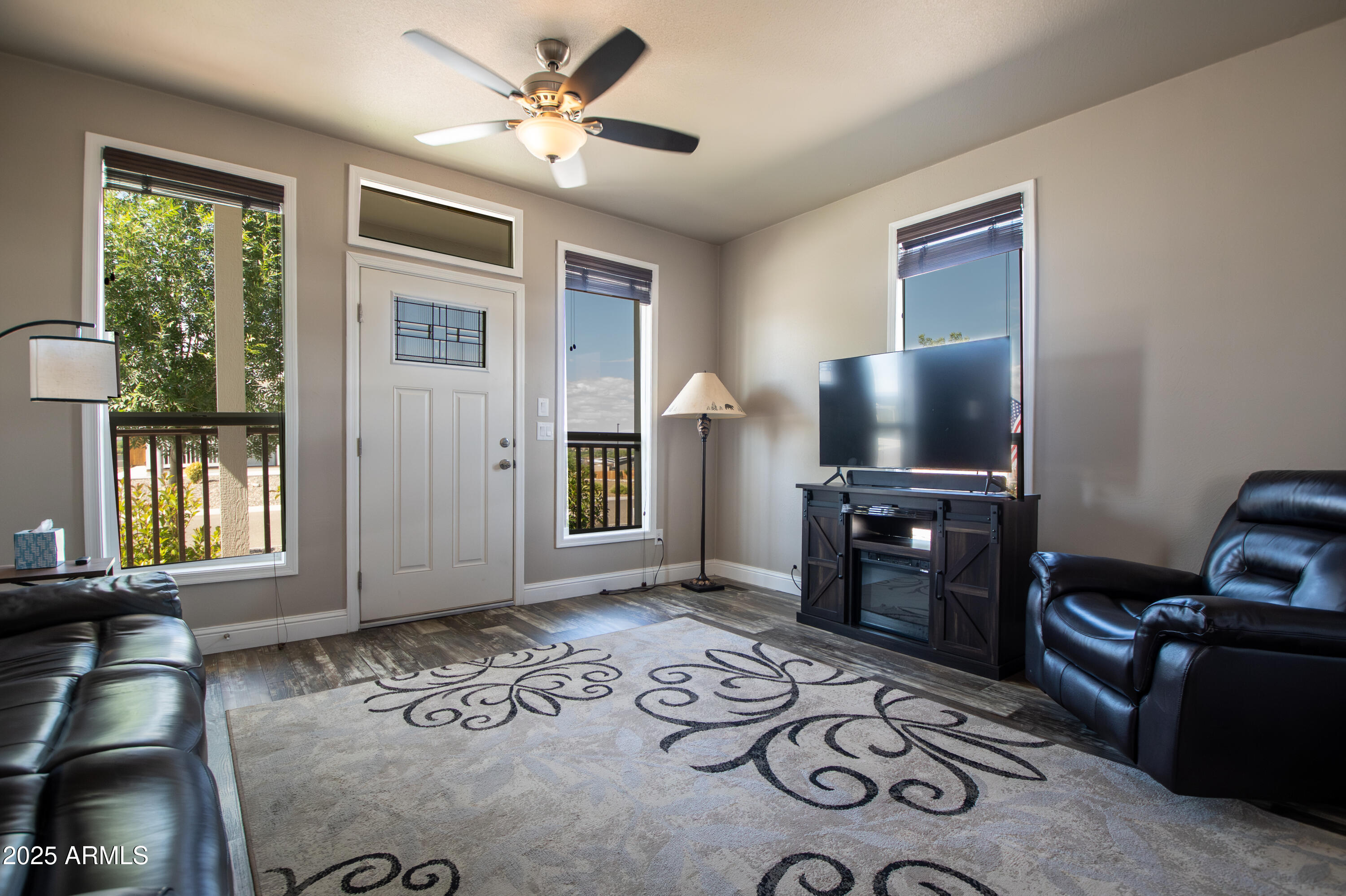 1007 Thorton Road Camp Verde, AZ 86322 - Photo 6 of 32 a living room with furniture a window and a flat screen tv