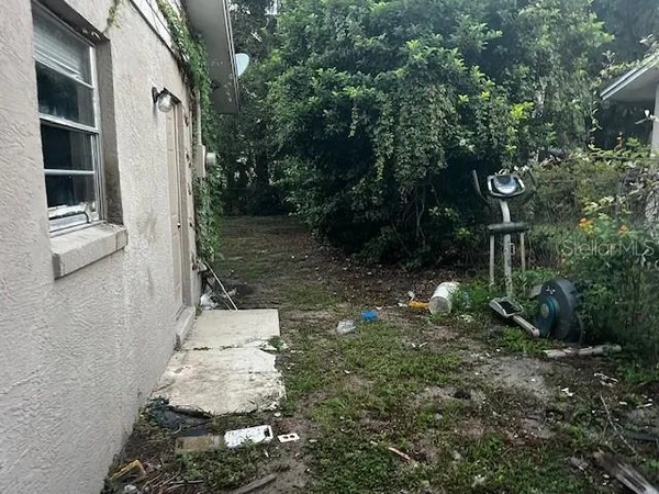 a backyard of a house with lots of green space