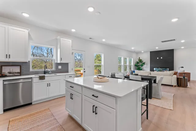 a dining room with furniture and a flat screen tv