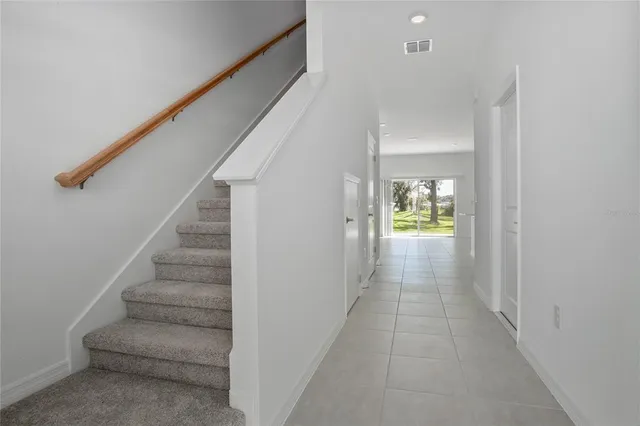 a view of an entryway with wooden floor