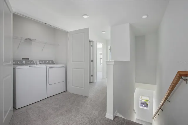 a view of a storage & utility room with a sink