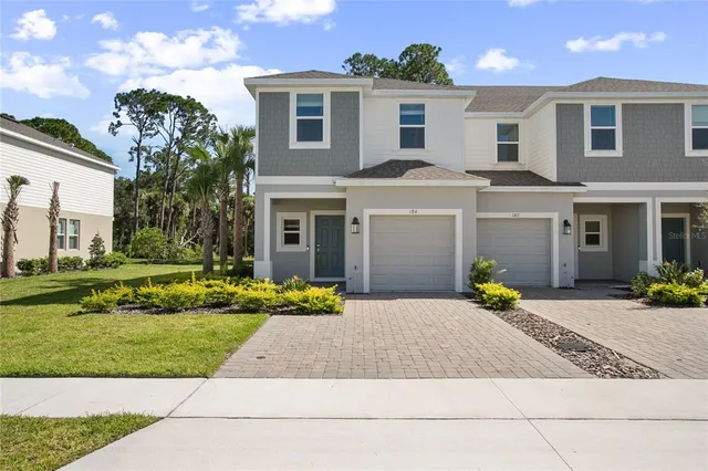 a view of a yard in front of a house