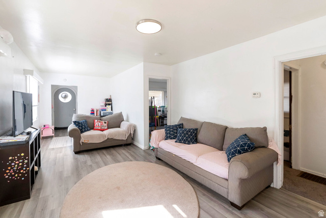 654 North 100 East Logan, UT 84321 - Photo 5 of 41 Living room with light wood-style floors and baseboards