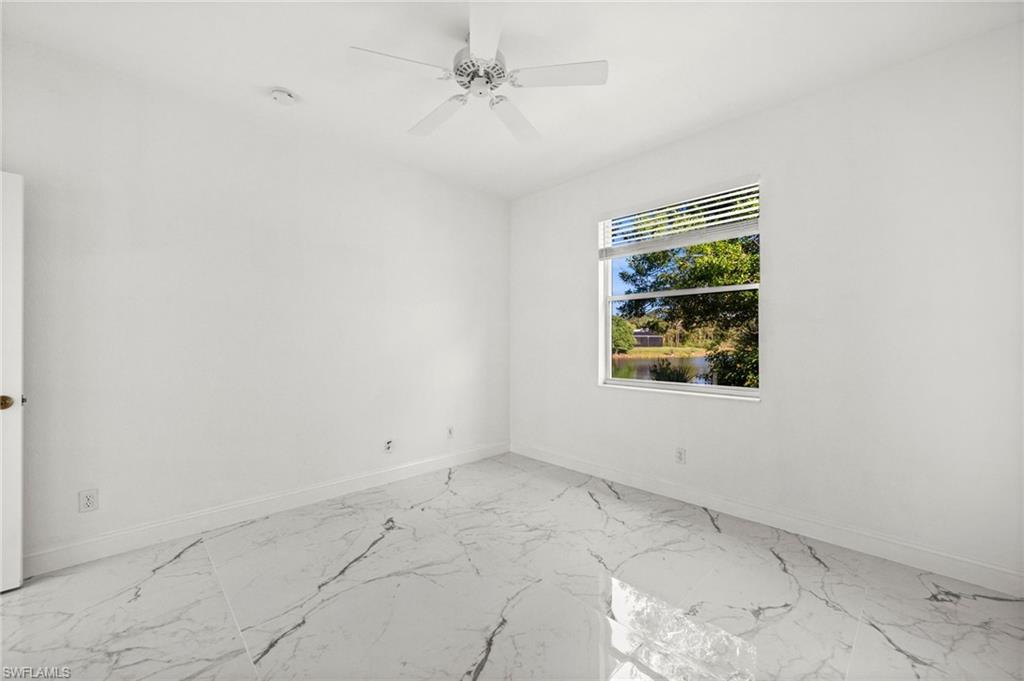 3972 Ruxton Road Naples, FL 34116 - Photo 31 of 41 an empty room with windows