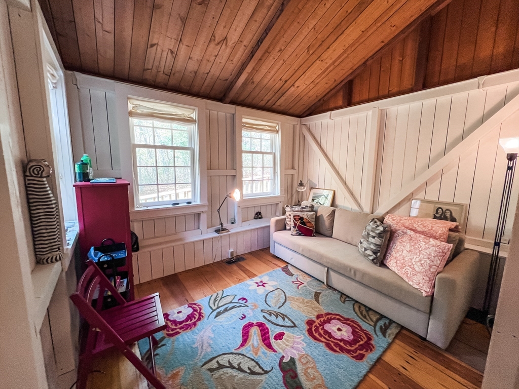 225 Lamberts Cove Road West Tisbury, MA 02568 - Photo 12 of 33 a living room with furniture and a wooden floor