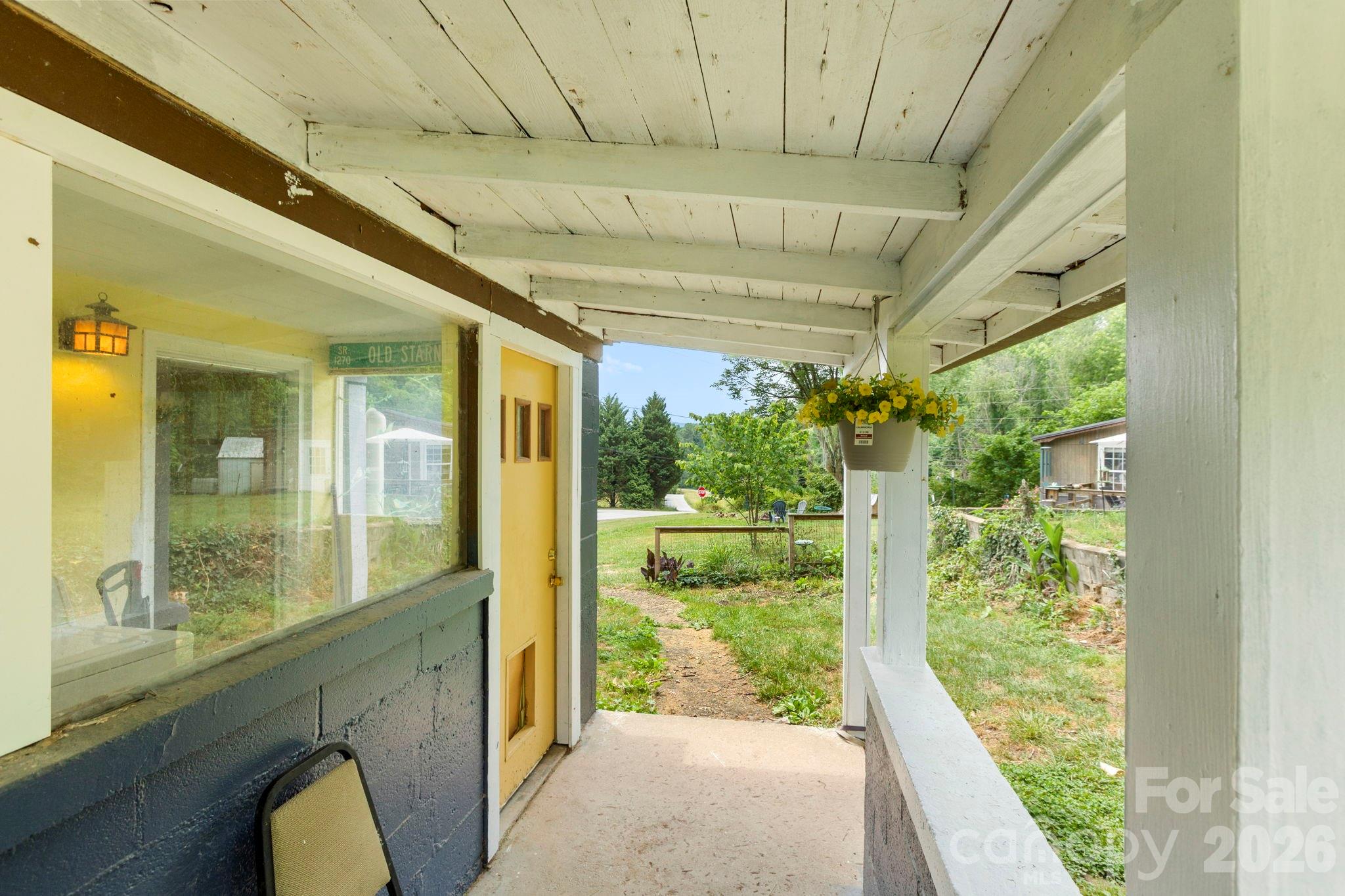 4 Mountain View Road Asheville, NC 28806 - Photo 4 of 35 a view of a porch and garden