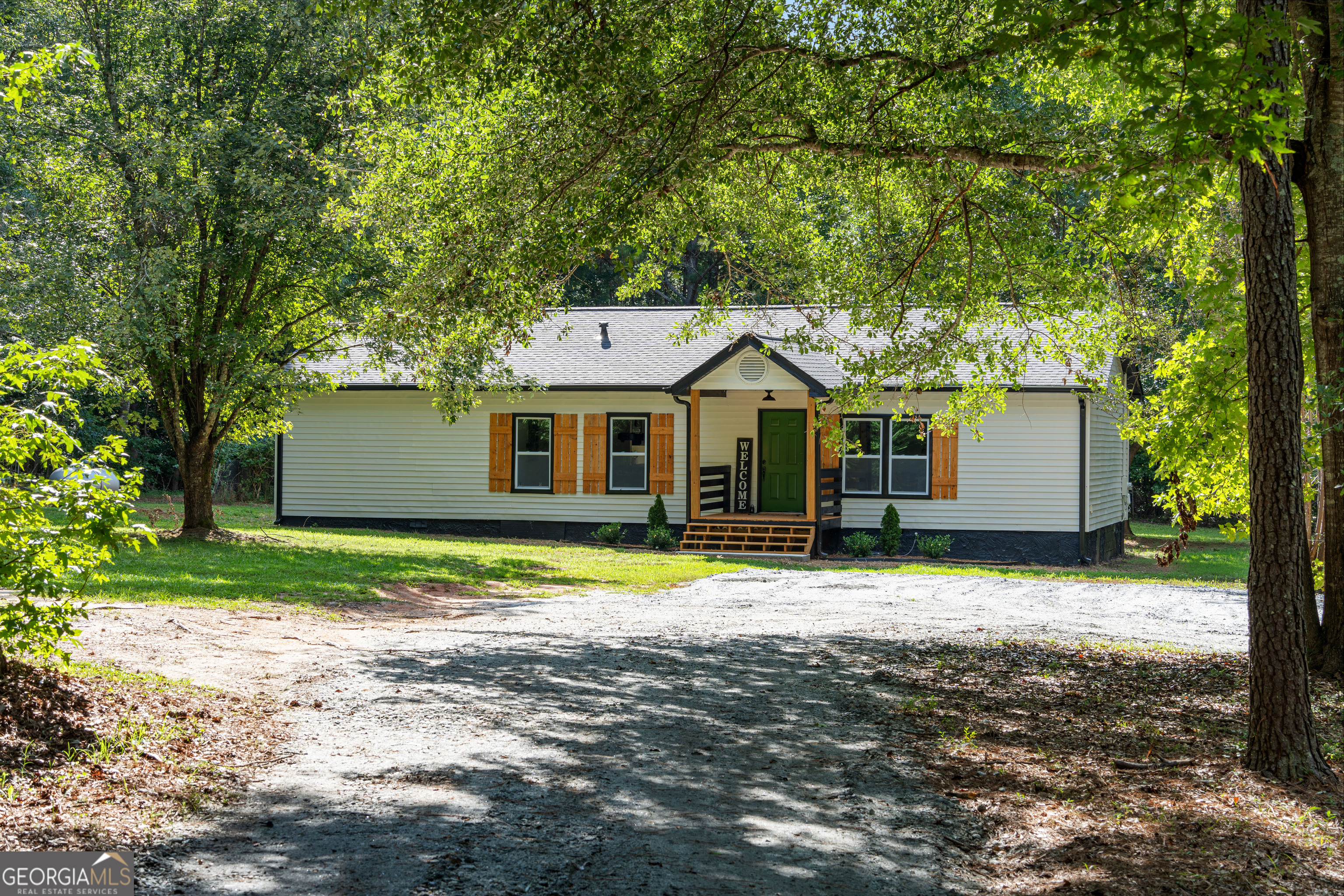 364 Yarbrough Mill Road Williamson, GA 30292 - Photo 1 of 1 a front view of a house with a yard and garage