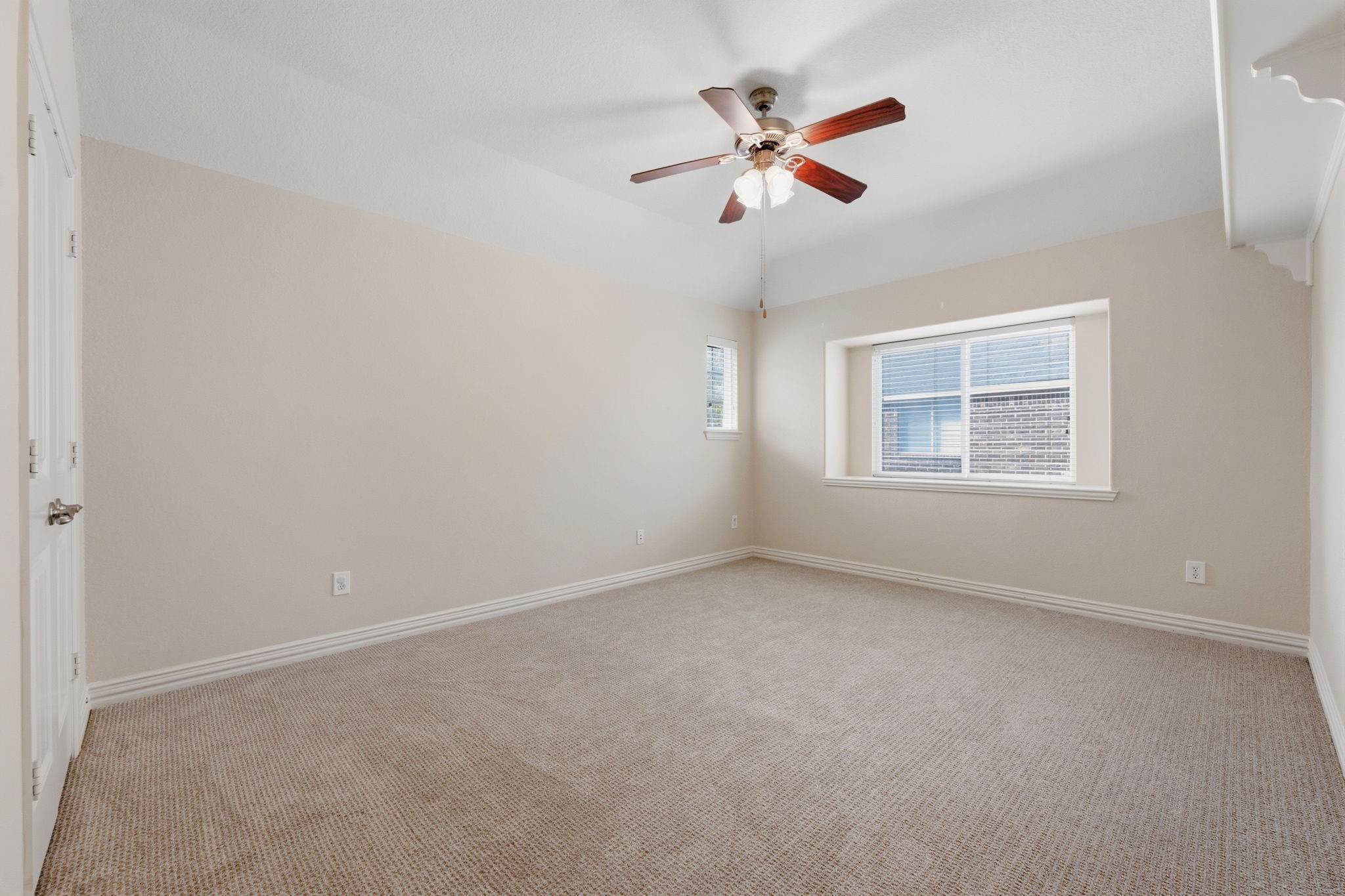 315 Arbor Ridge Lane Conroe, TX 77384 - Photo 30 of 48 an empty room with a window and a ceiling fan
