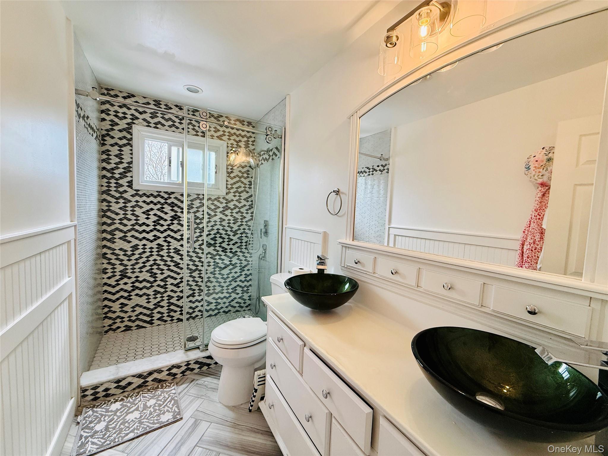 1663 Waring Avenue Bronx, NY 10469 - Photo 19 of 34 a bathroom with a sink toilet and shower