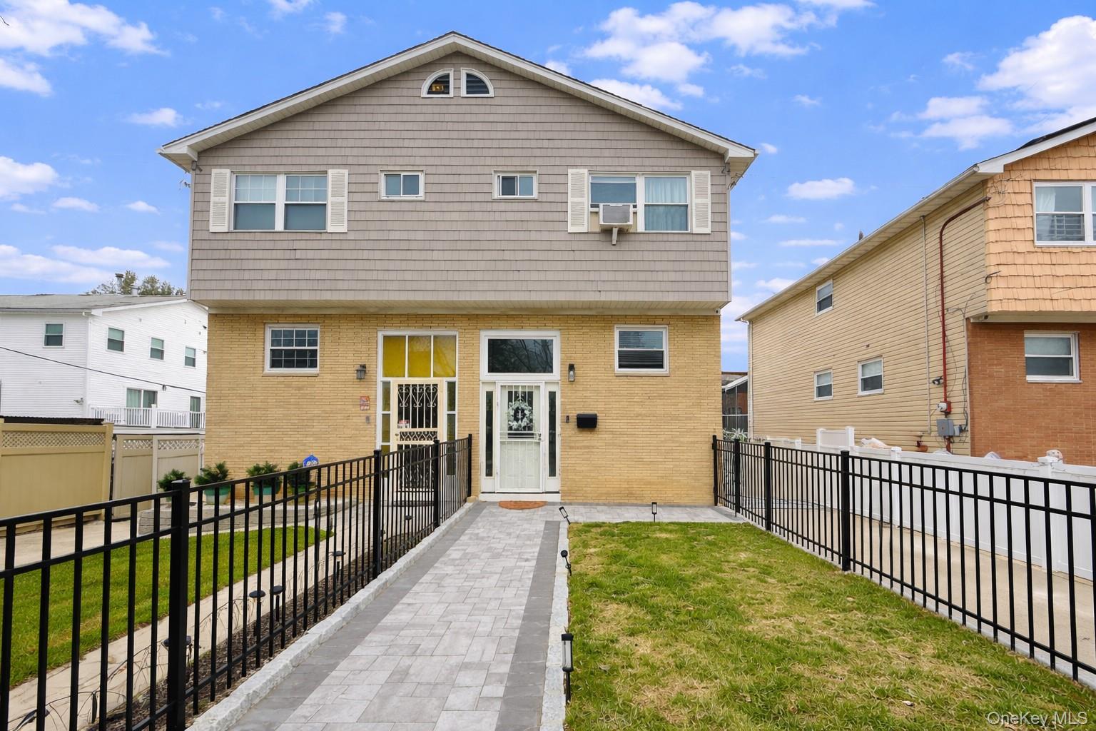 1663 Waring Avenue Bronx, NY 10469 - Photo 2 of 34 a front view of house with yard
