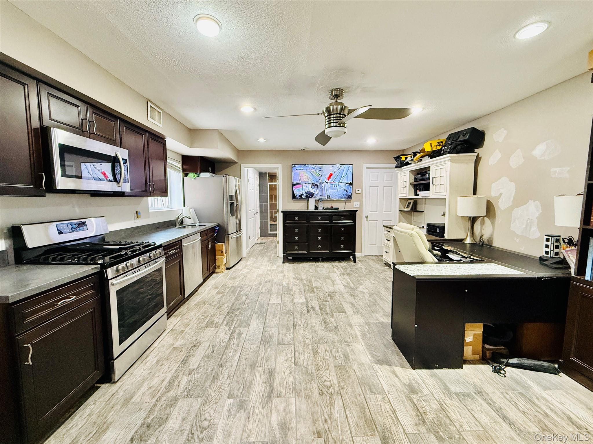 1663 Waring Avenue Bronx, NY 10469 - Photo 22 of 34 a kitchen with stainless steel appliances granite countertop a stove and a sink