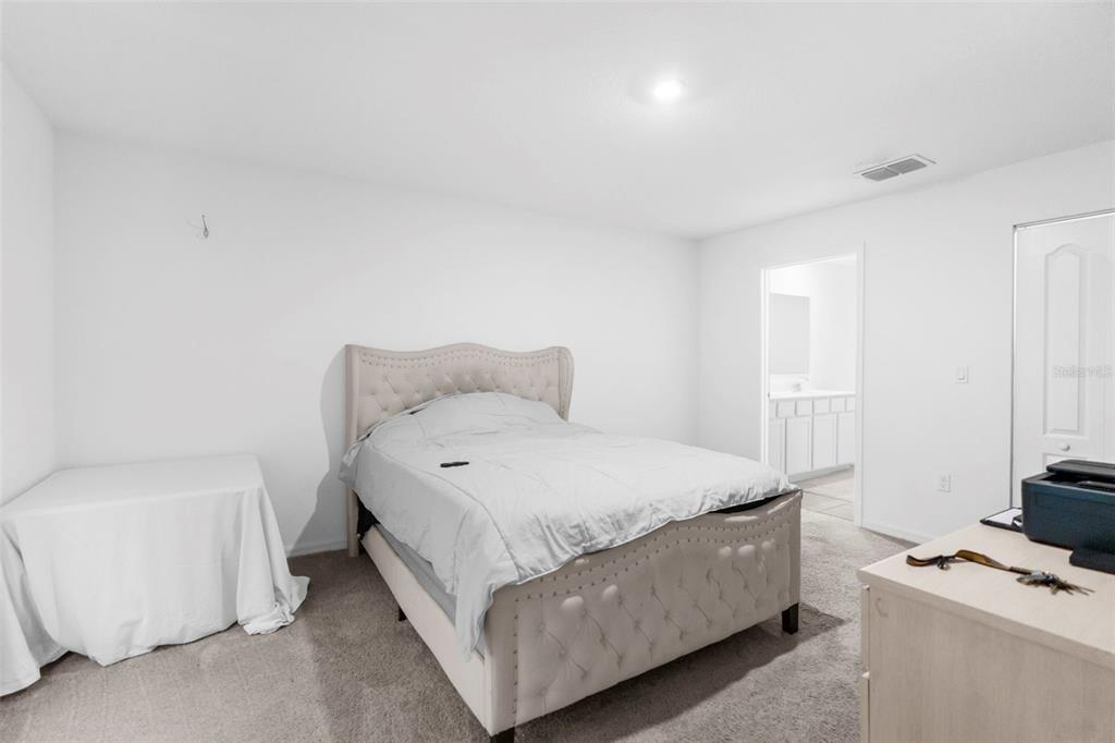 5637 East Tangelo Lane Inverness, FL 34453 - Photo 17 of 23 a bedroom with a bed and a window