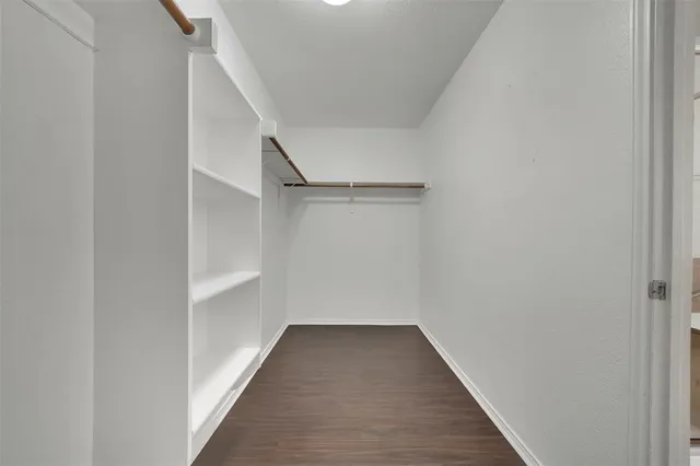 a view of a garden with a building in the background