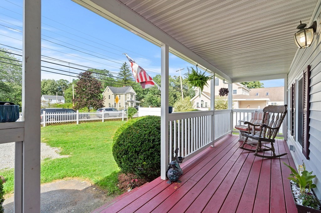 72 Beach Road Salisbury, MA 01952 - Photo 5 of 37 a view of a chairs and table in patio with wooden fence