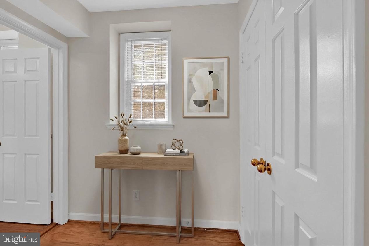3839 Rodman Street Northwest, Unit F36 Washington, DC 20016 - Photo 26 of 35 staged photo foyer to bathroom