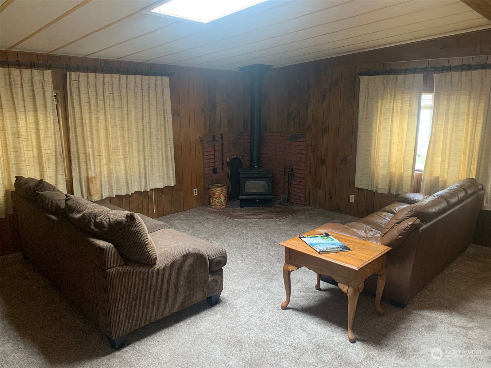212 Old Owen Road, Unit 65 Sultan, WA 98294 - Photo 9 of 12 a living room with furniture and a window
