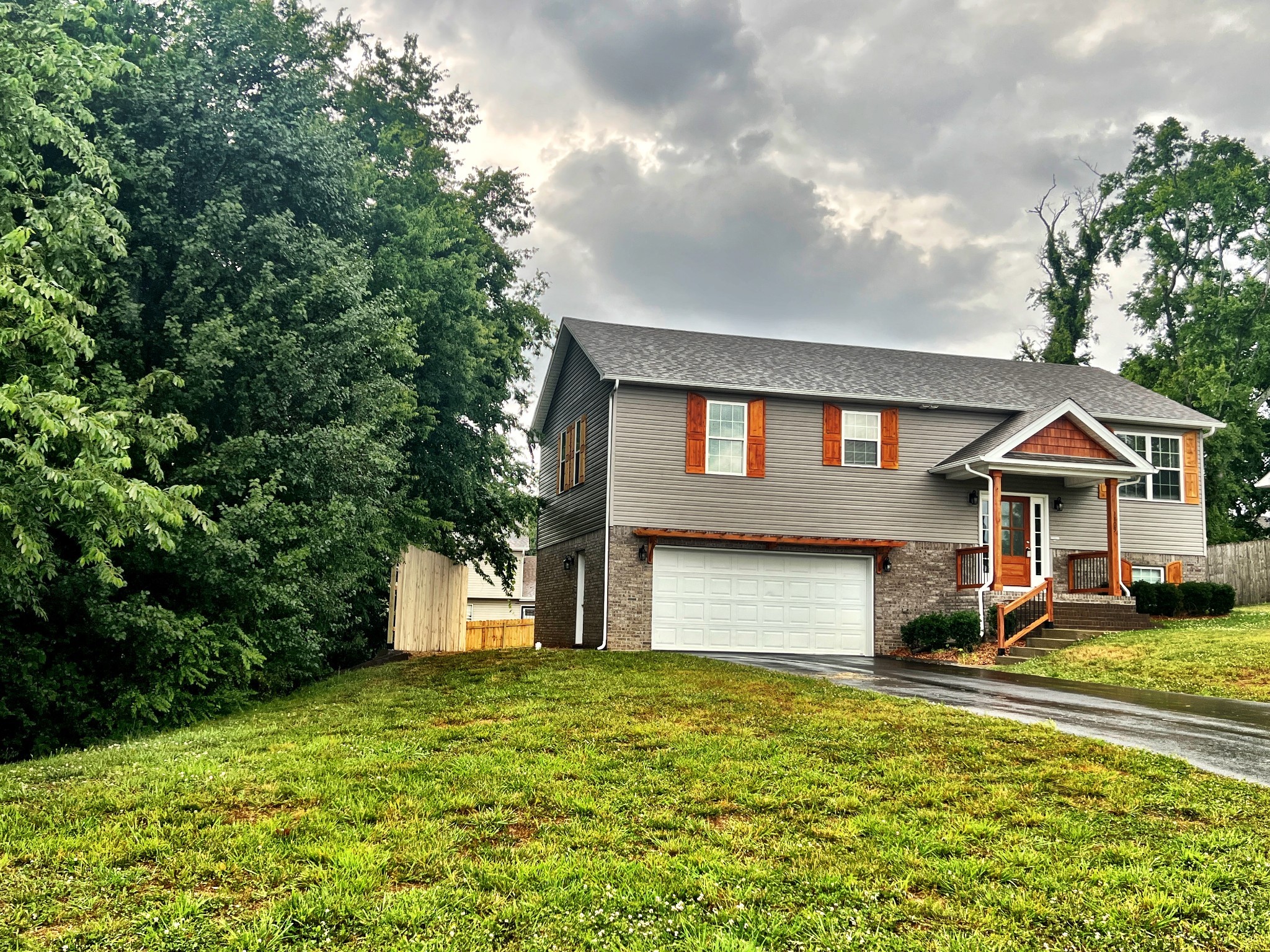 a front view of a house with a yard