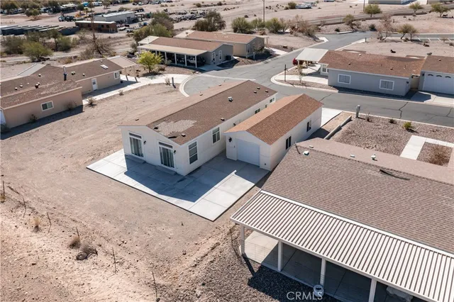 an aerial view of a house with outdoor space