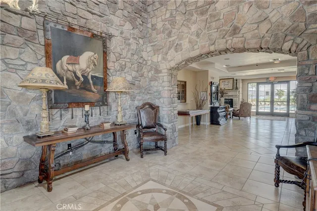 a lobby with furniture and wooden floor