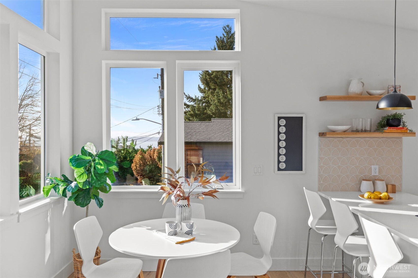 8407 42nd Avenue Southwest Seattle, WA 98136 - Photo 11 of 34 a view of a dining room with furniture window and wooden floor