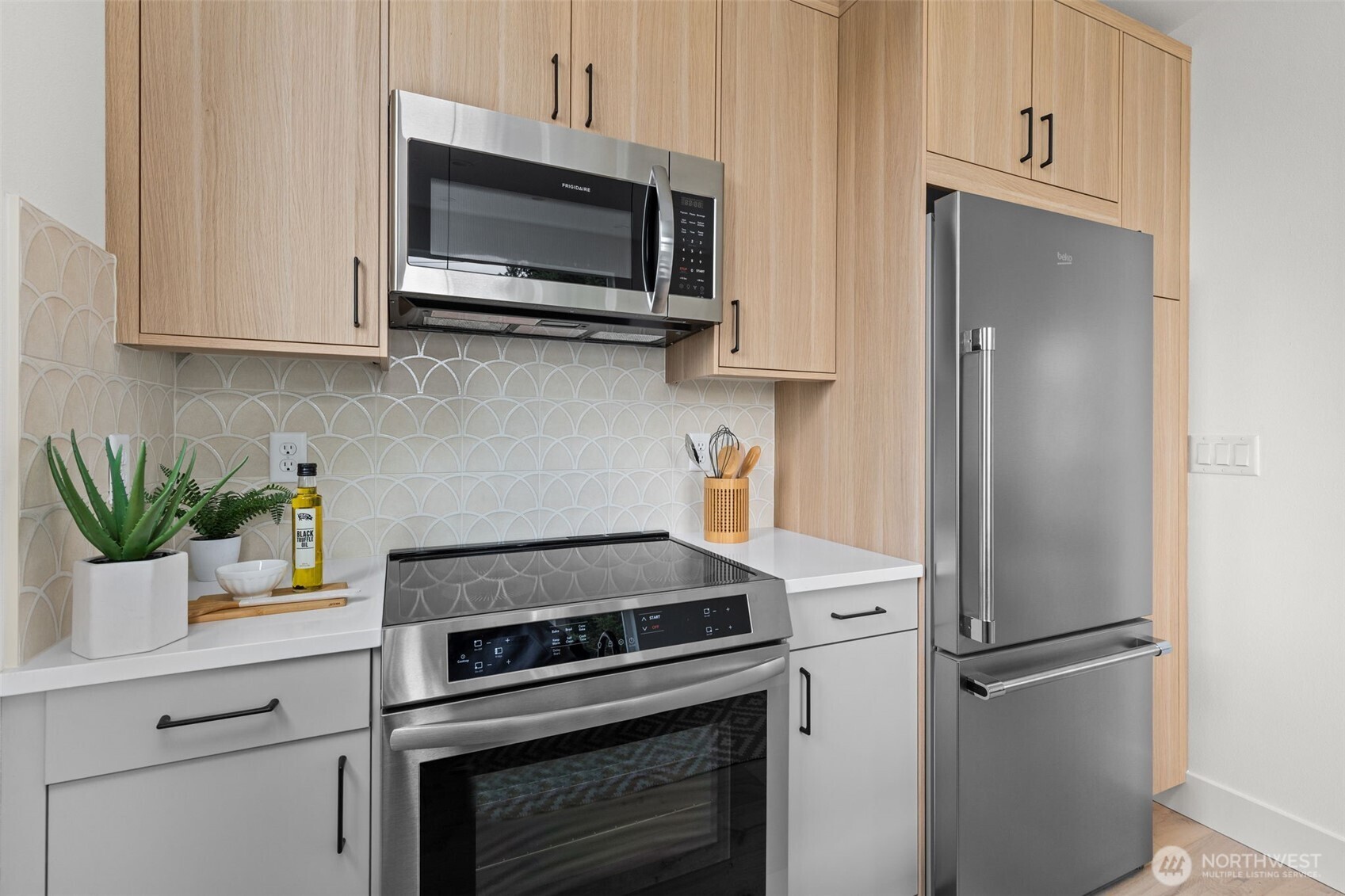 8407 42nd Avenue Southwest Seattle, WA 98136 - Photo 16 of 34 a kitchen with a stove and a microwave