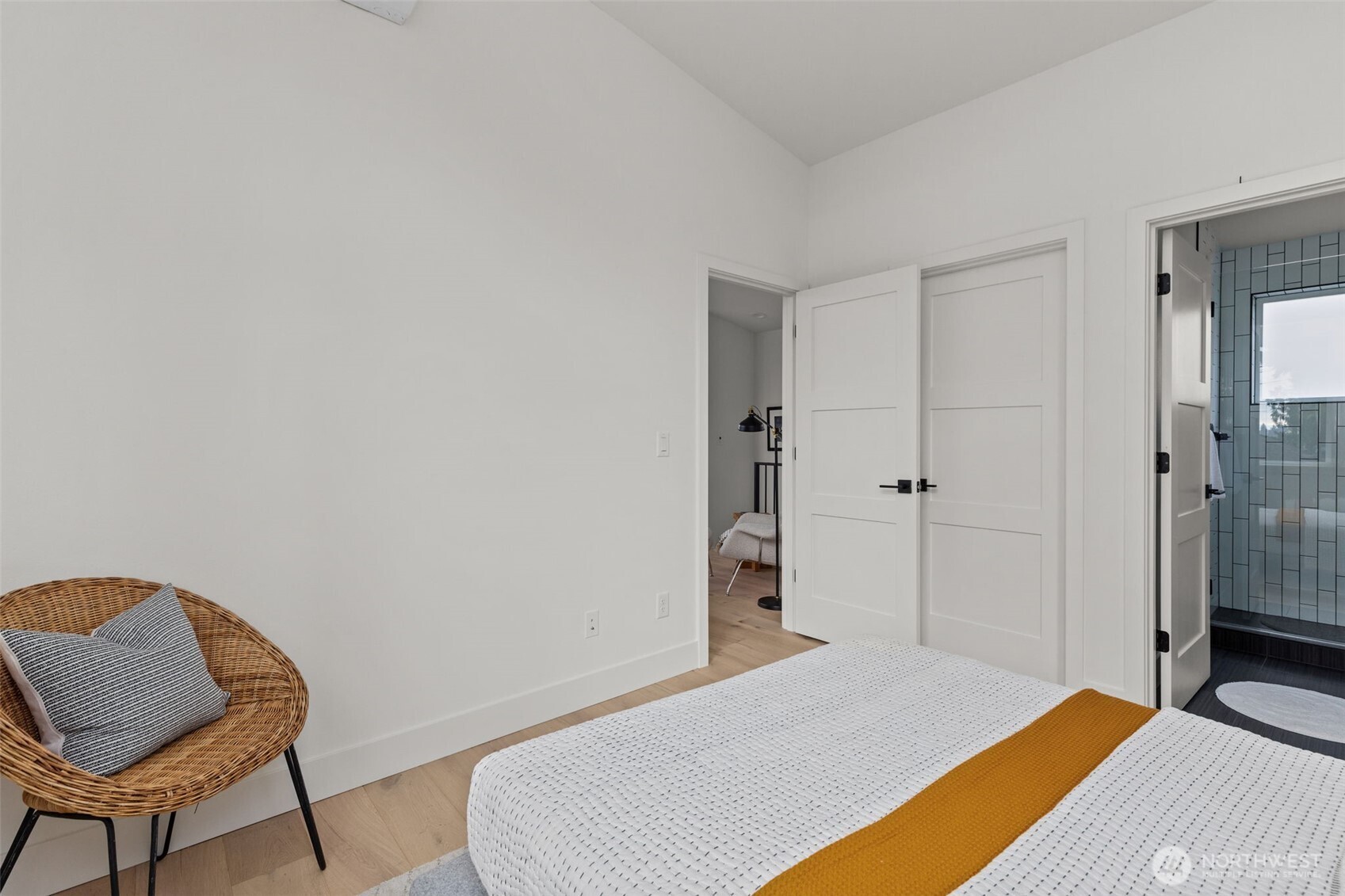 8407 42nd Avenue Southwest Seattle, WA 98136 - Photo 19 of 34 a bedroom with a bed and a chair