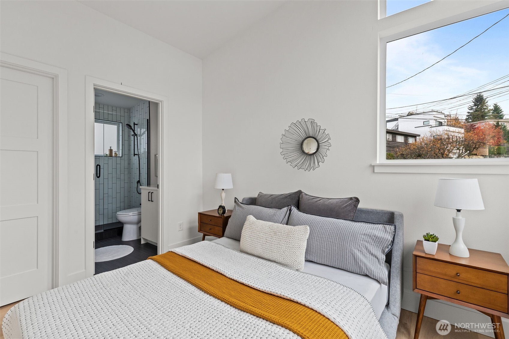 8407 42nd Avenue Southwest Seattle, WA 98136 - Photo 20 of 34 a bedroom with a bed and painting on the wall