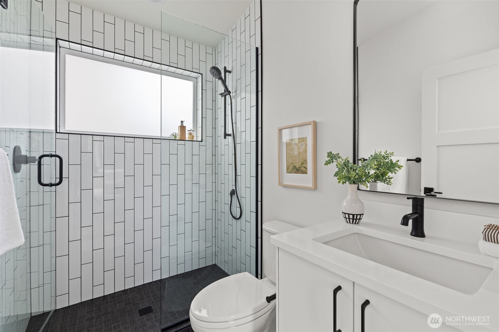 8407 42nd Avenue Southwest Seattle, WA 98136 - Photo 21 of 34 a bathroom with a sink a toilet and shower