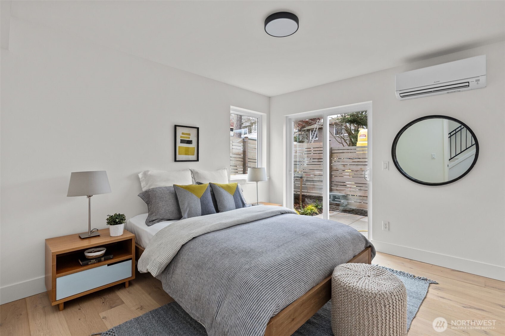 8407 42nd Avenue Southwest Seattle, WA 98136 - Photo 22 of 34 a bed room with a bed and a chair