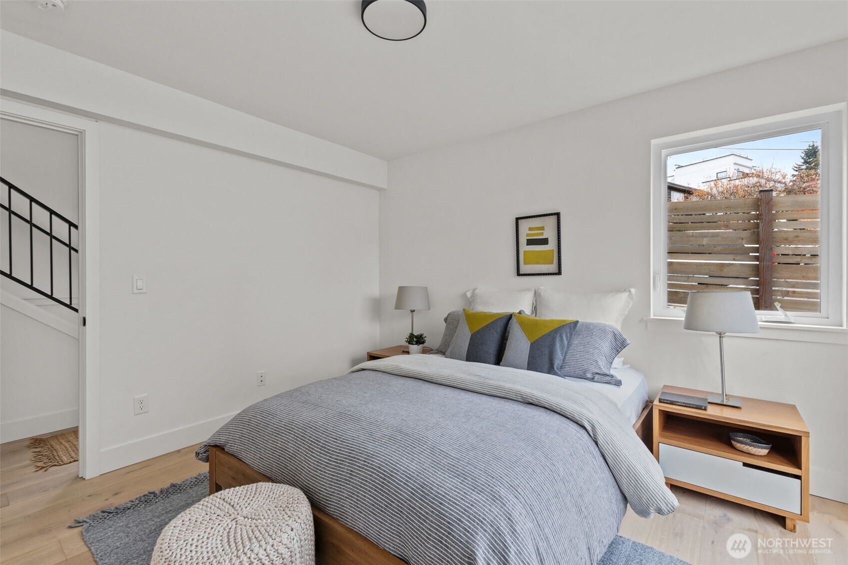 8407 42nd Avenue Southwest Seattle, WA 98136 - Photo 24 of 34 a bedroom with bed and a window