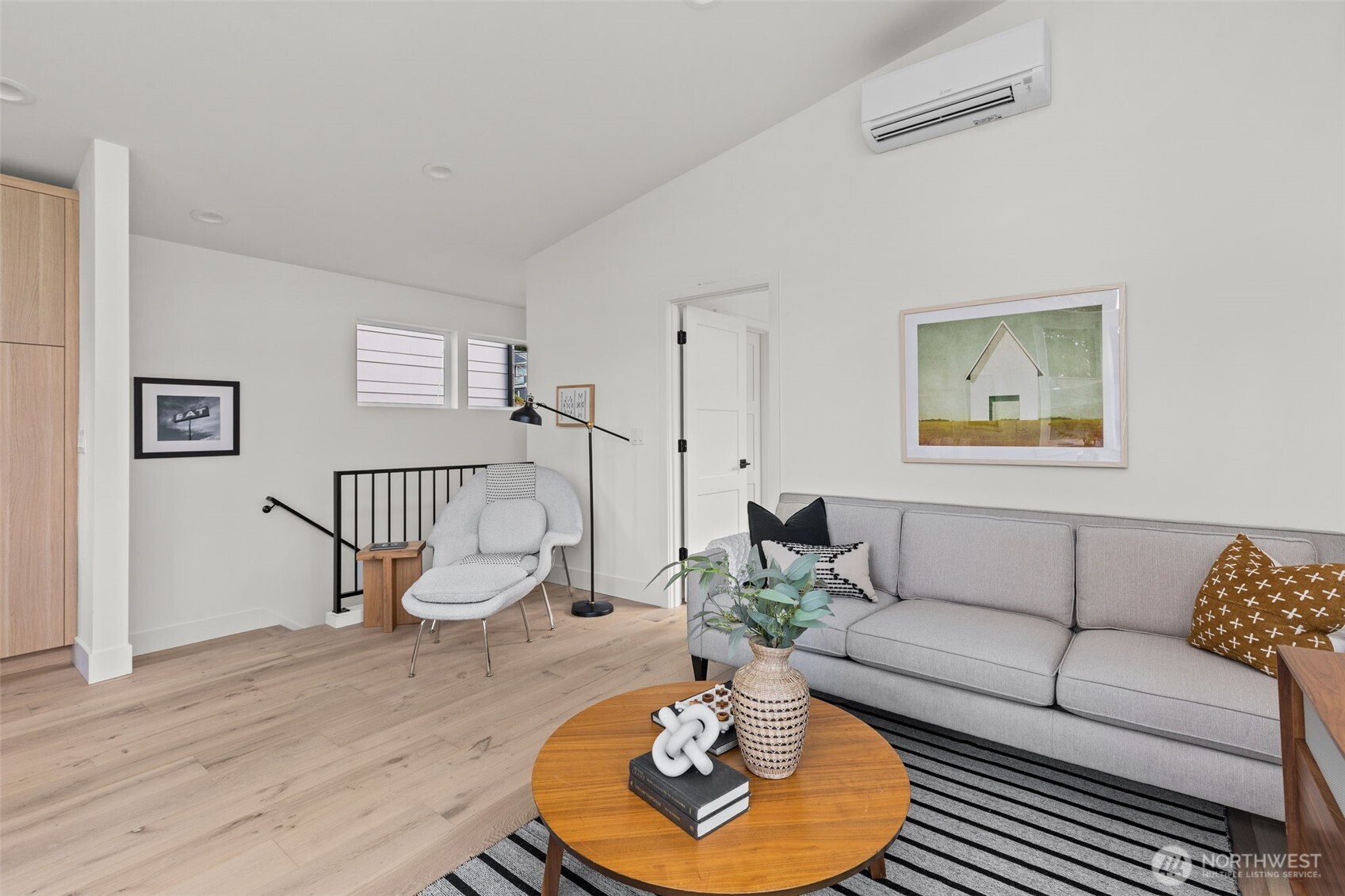 8407 42nd Avenue Southwest Seattle, WA 98136 - Photo 7 of 34 a living room with furniture potted plant and wooden floor