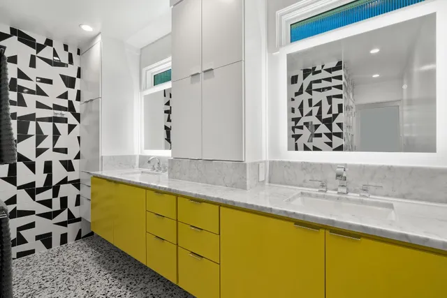 a backyard of a house with table and chairs