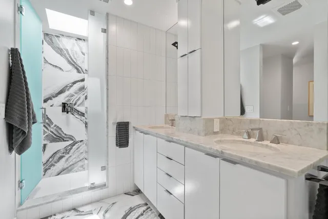 a bedroom with a bed and a lamp