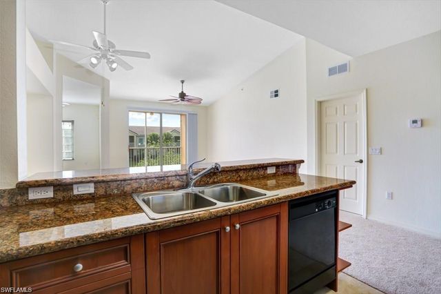a kitchen with a sink and a window