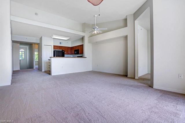 a view of a kitchen with a sink and cabinet area