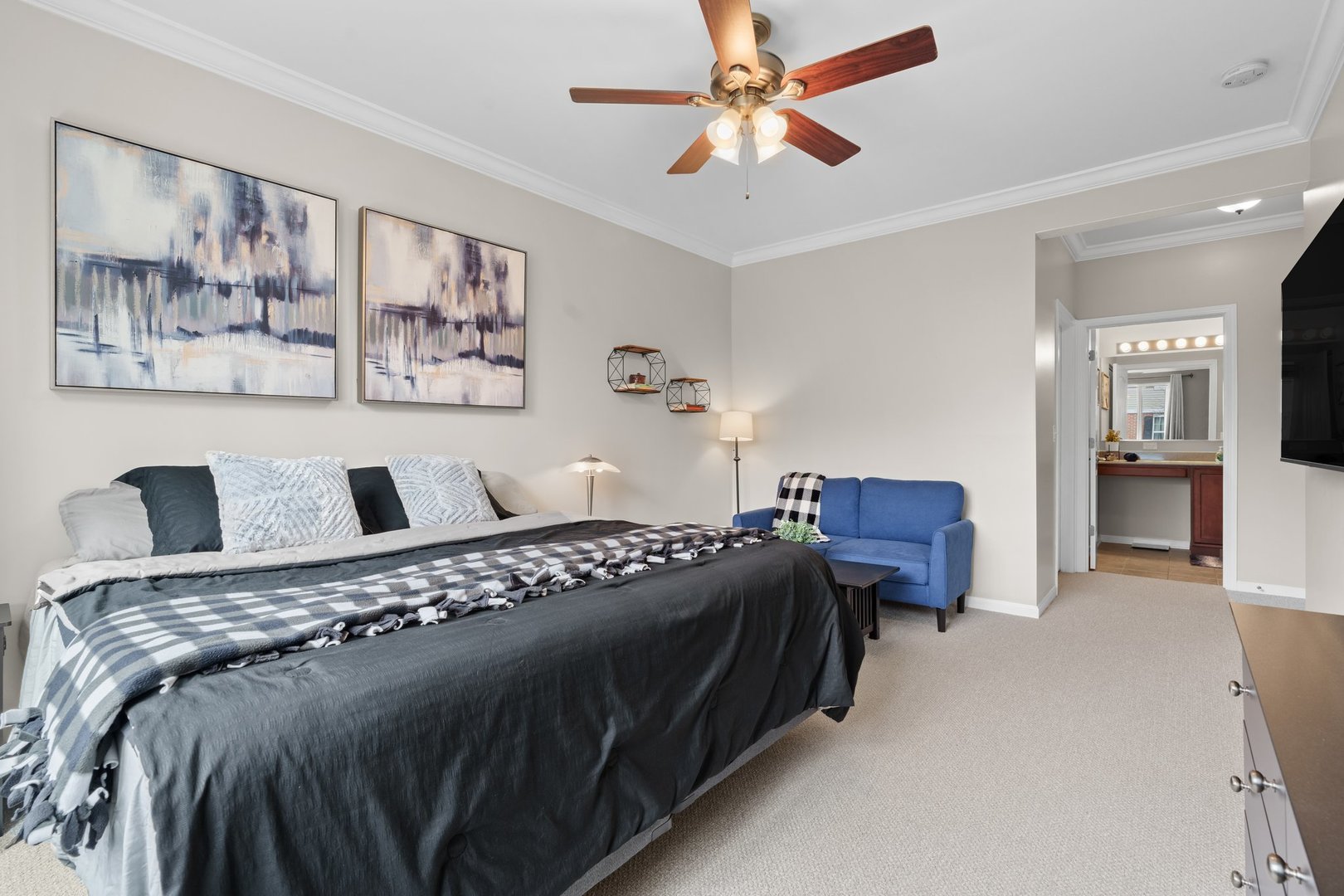 1116 Draper Road, Unit 1116 McHenry, IL 60050 - Photo 12 of 20 a bedroom with a bed and a chandelier